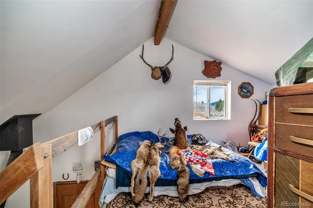 a bed room with furniture and a window