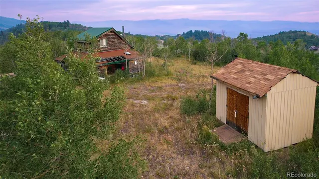 a aerial view of a house with a yard