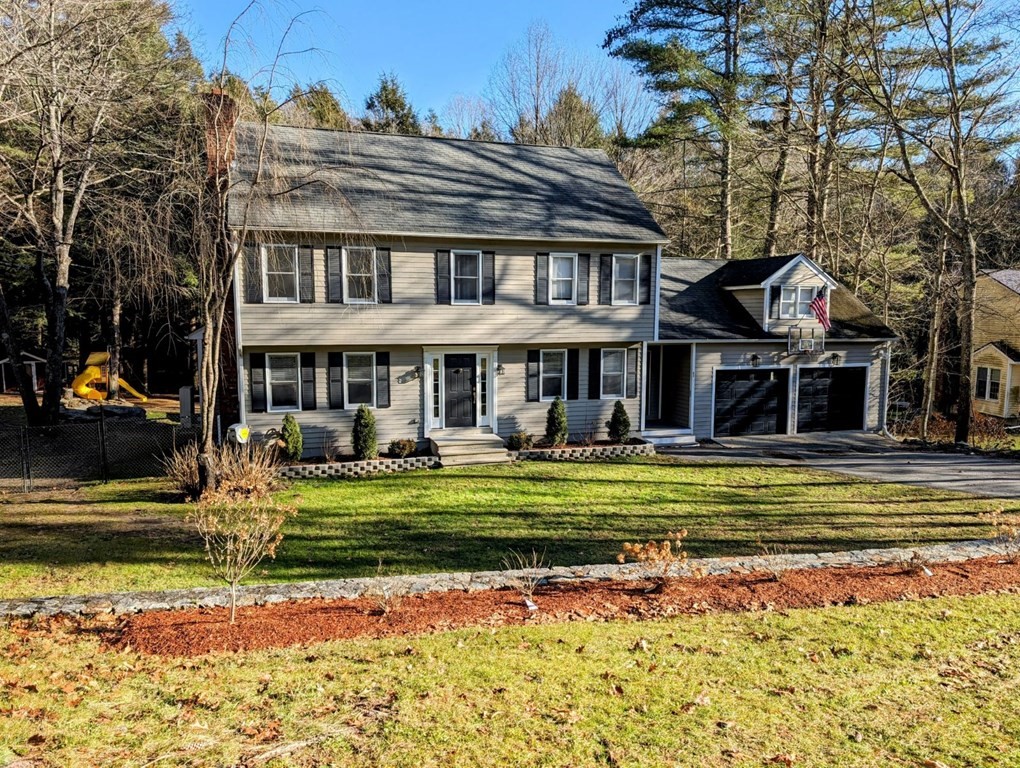 93 Blood Road Charlton, MA 01507 - Photo 1 of 42 a front view of a house with a yard table and chairs