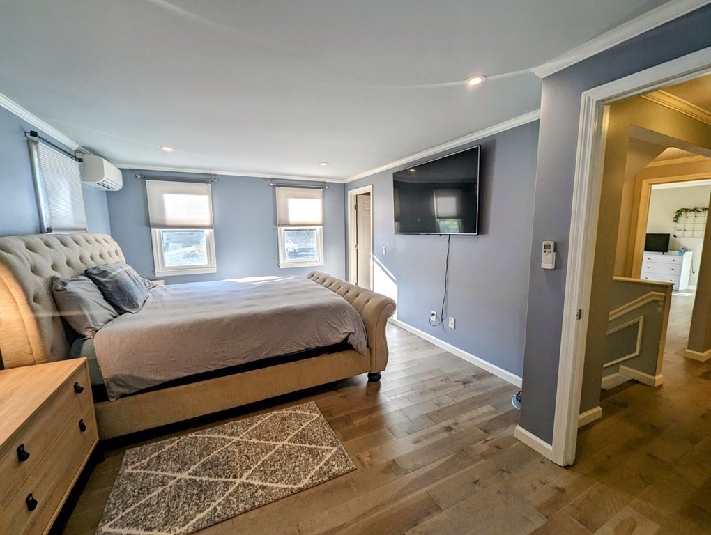 93 Blood Road Charlton, MA 01507 - Photo 12 of 42 a bedroom with a bed and a flat screen tv