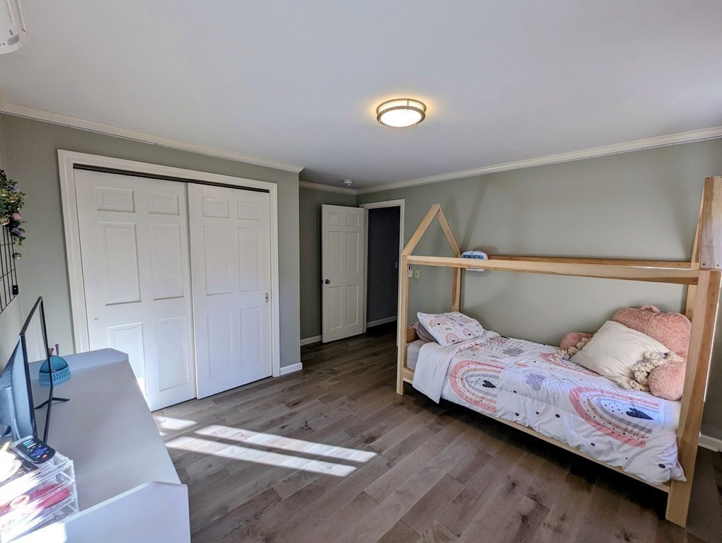 93 Blood Road Charlton, MA 01507 - Photo 17 of 42 a bedroom with a bed and chair