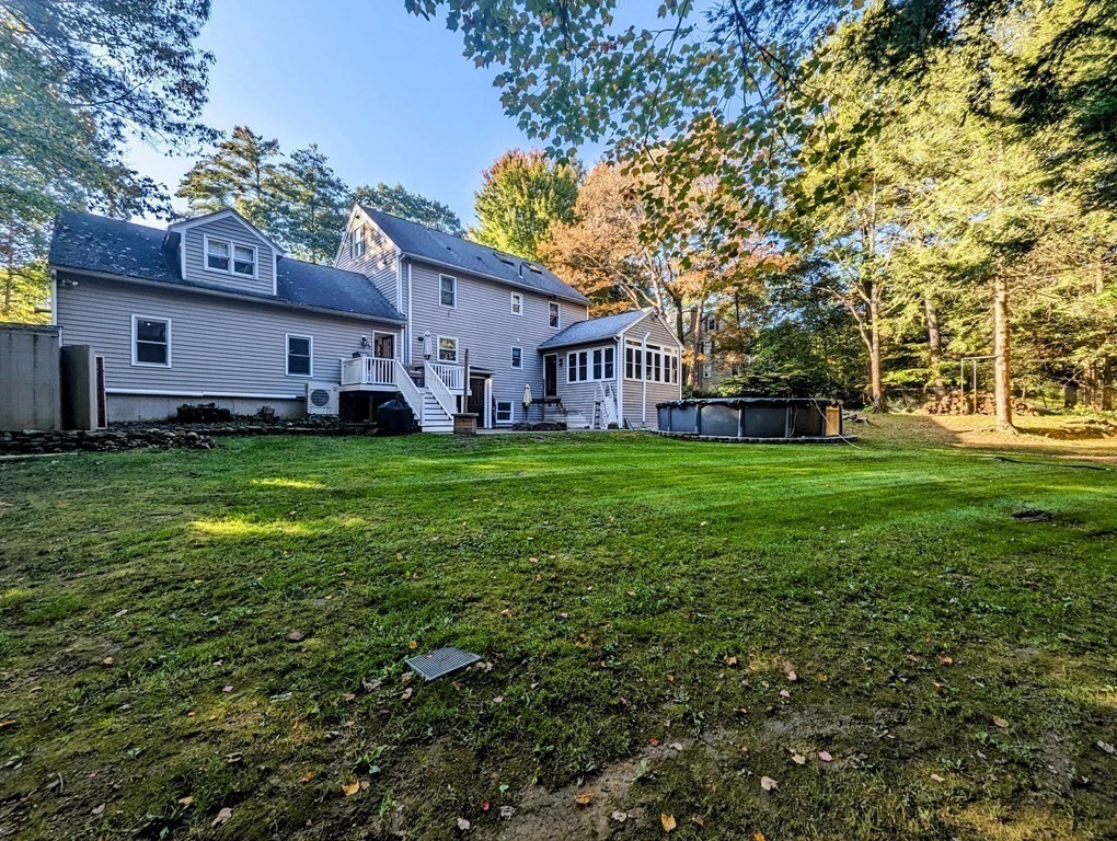 93 Blood Road Charlton, MA 01507 - Photo 2 of 42 a house view with a sitting space and garden