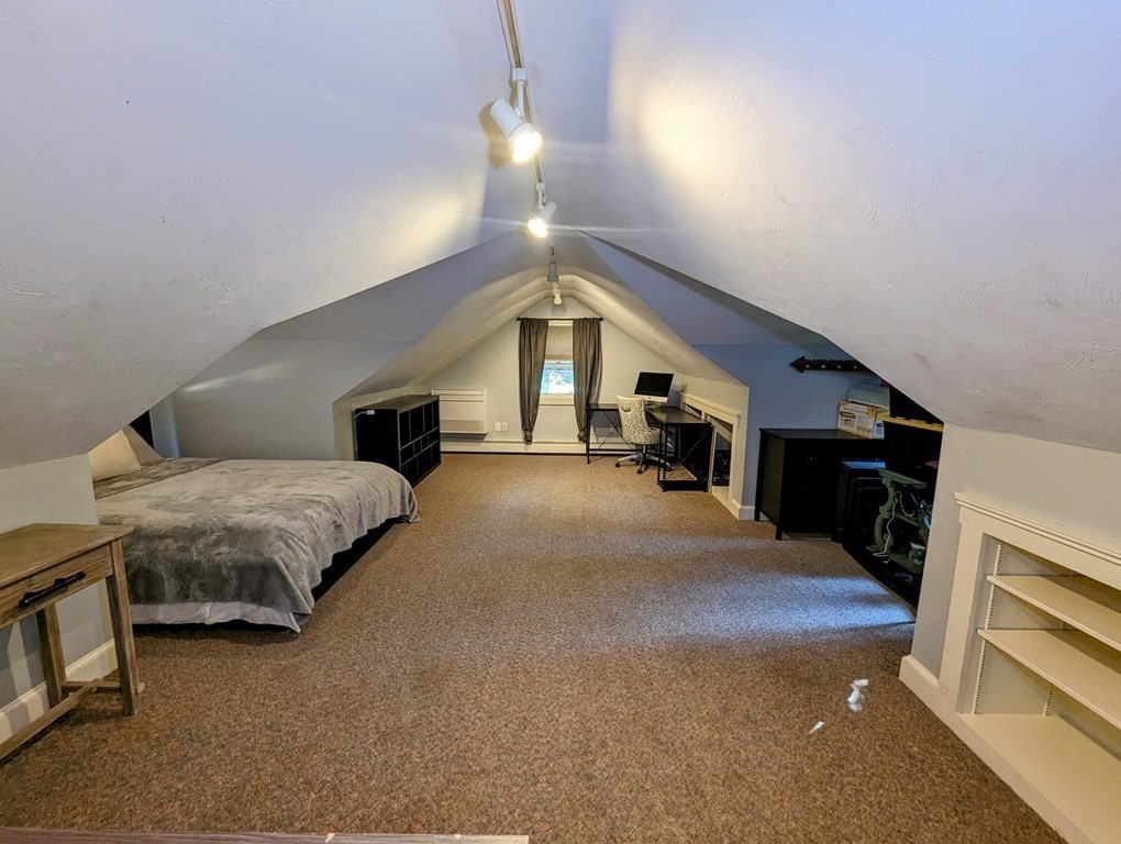 93 Blood Road Charlton, MA 01507 - Photo 21 of 42 a spacious bedroom with a large bed and a chandelier