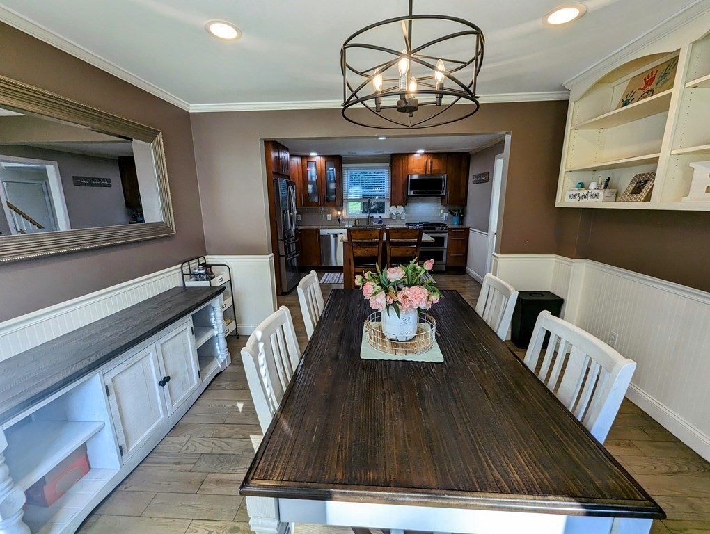 93 Blood Road Charlton, MA 01507 - Photo 27 of 42 a view of a dining room with furniture wooden floor and chandelier