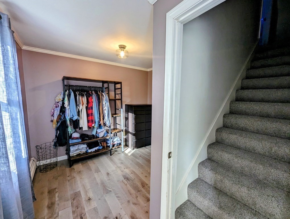 93 Blood Road Charlton, MA 01507 - Photo 30 of 42 a view of a hallway with wooden floor and staircase