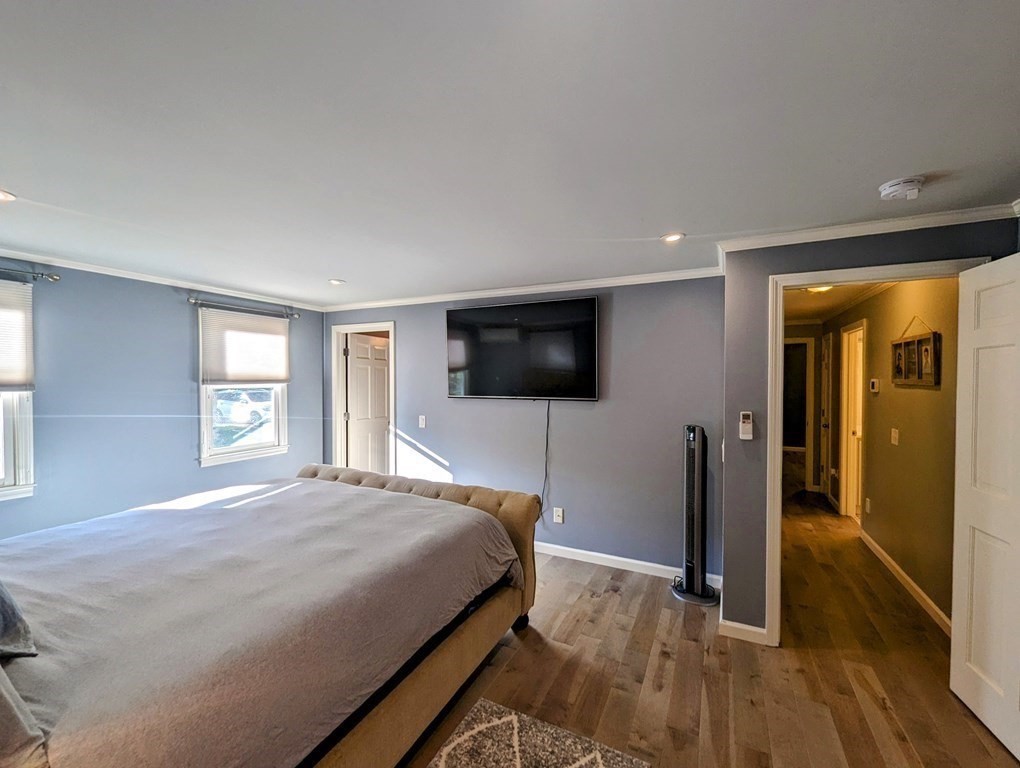 93 Blood Road Charlton, MA 01507 - Photo 31 of 42 a bedroom with a bed and a flat screen television