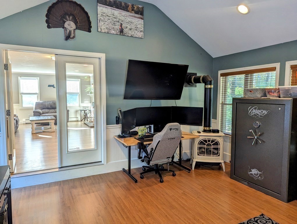 93 Blood Road Charlton, MA 01507 - Photo 4 of 42 a living room with furniture and a flat screen tv