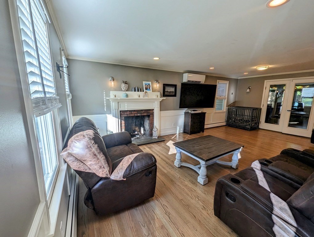 93 Blood Road Charlton, MA 01507 - Photo 5 of 42 a living room with furniture flat screen tv and a fireplace