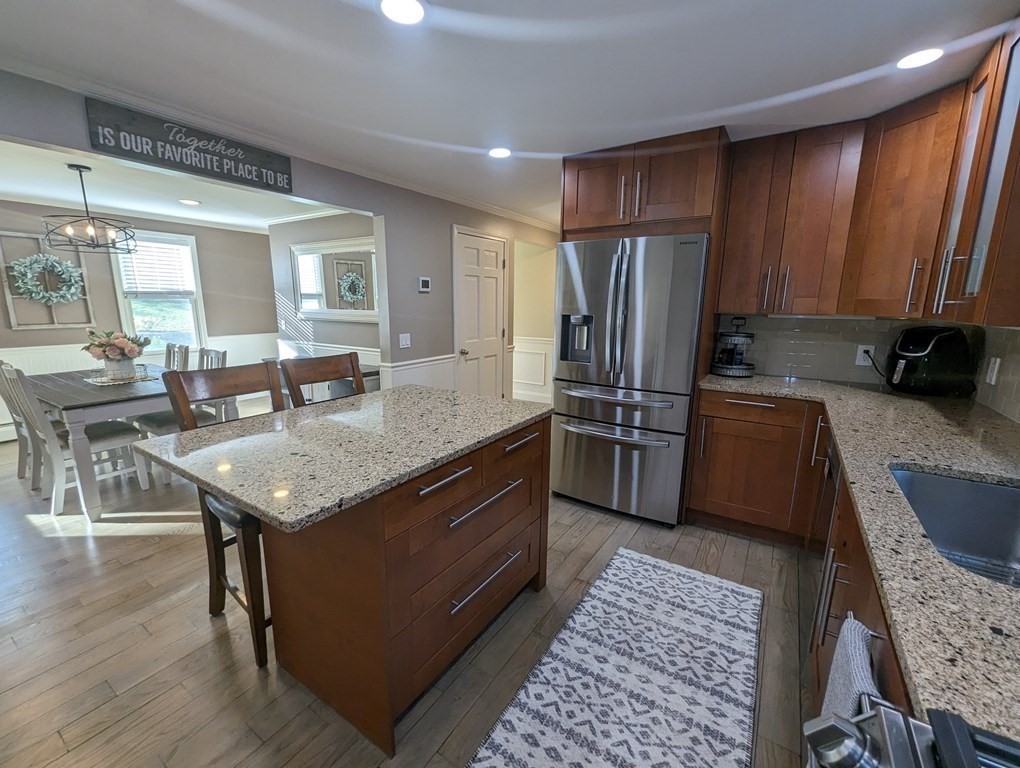 93 Blood Road Charlton, MA 01507 - Photo 10 of 42 a kitchen with granite countertop stainless steel appliances a sink a counter top space and cabinets