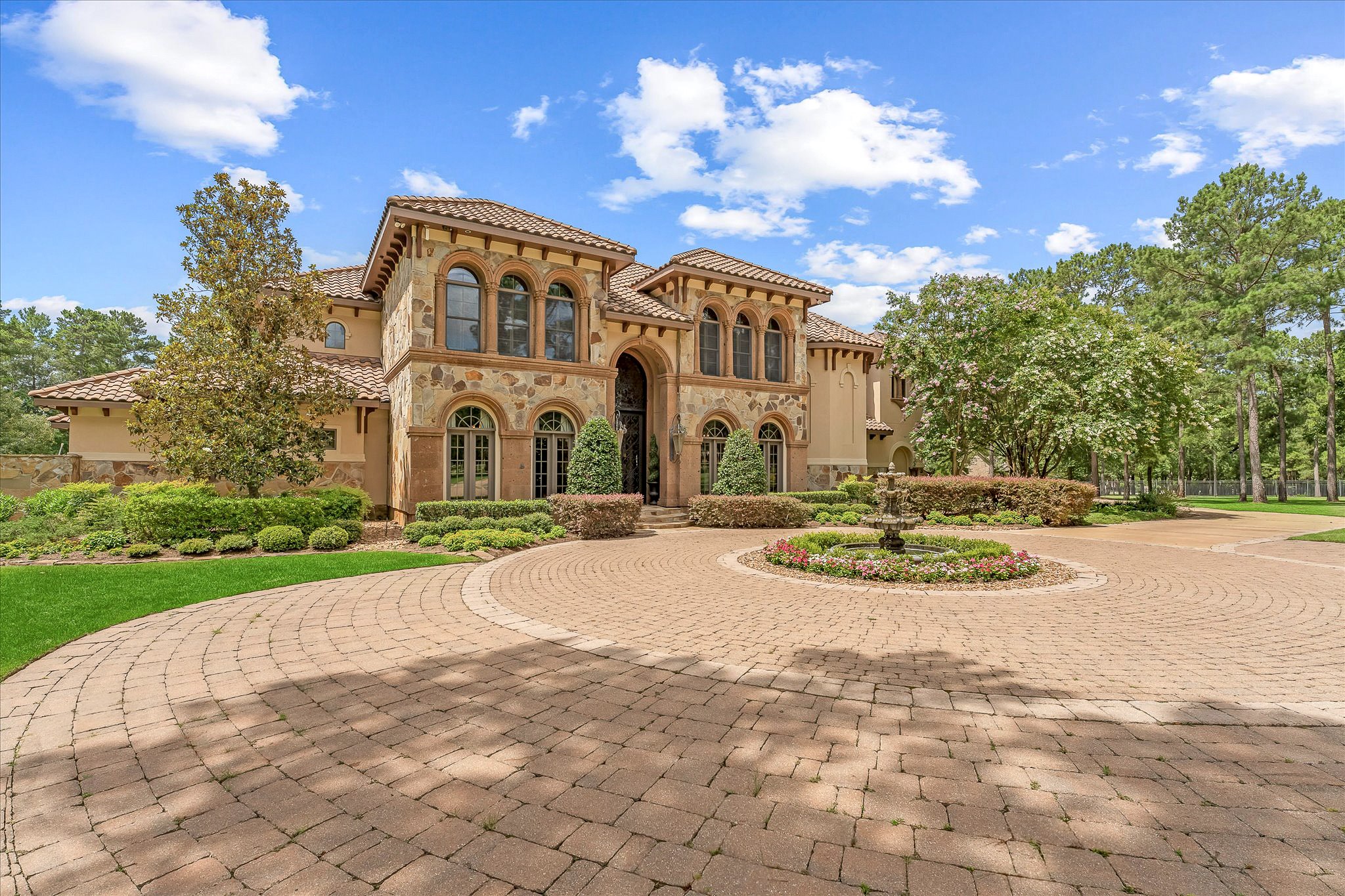 28322 Meadow Forest Magnolia, TX 77355 - Photo 1 of 50 Masterfully designed Mediterranean-style custom home features handcrafted finishes throughout. Situated on the green of Hole #1 at High Meadow Ranch Golf Course on just over 4 fully fenced & landscaped acres.