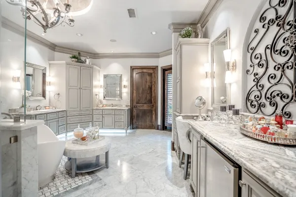a spacious bathroom with a granite countertop tub sink and mirror