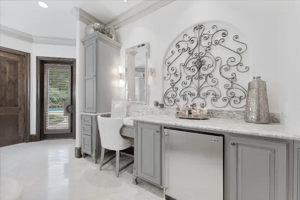 a spacious bathroom with a granite countertop sink and a mirror