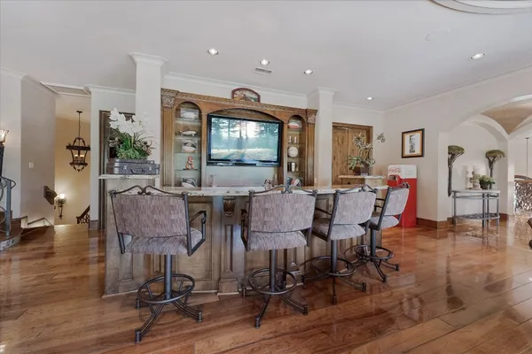 a view of a dining room with furniture window and wooden floor