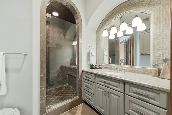 a bathroom with a sink and a mirror