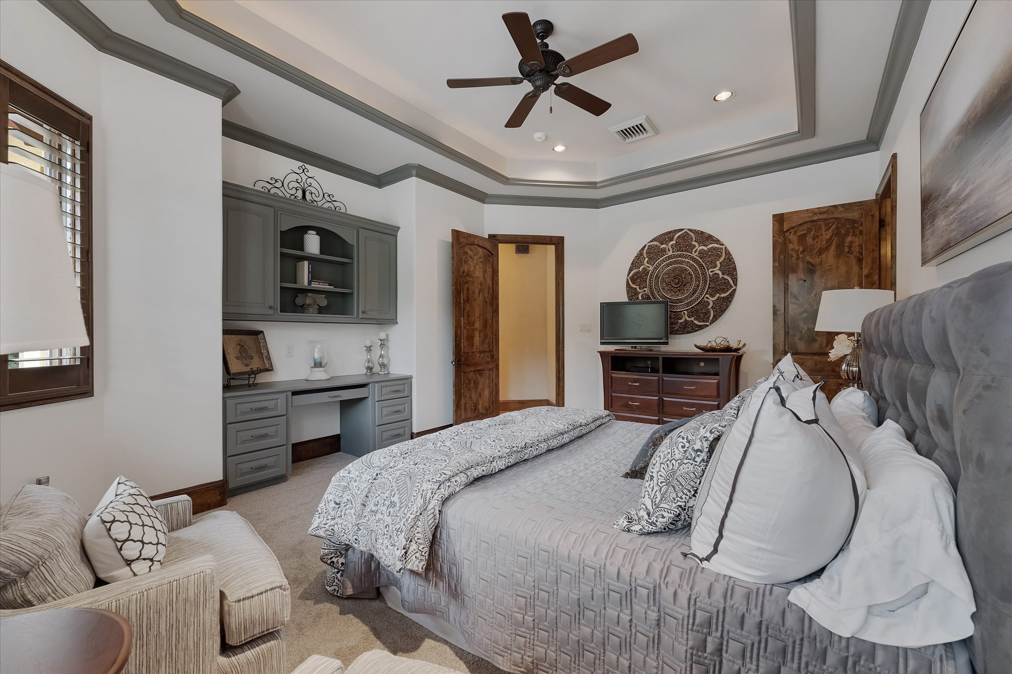 28322 Meadow Forest Magnolia, TX 77355 - Photo 35 of 50 Guest Bedroom #3 on the second floor. Includes built-in desk with custom cabinetry that offers lower closed storage and open shelving. Windows offer views of the backyard and southern exposures