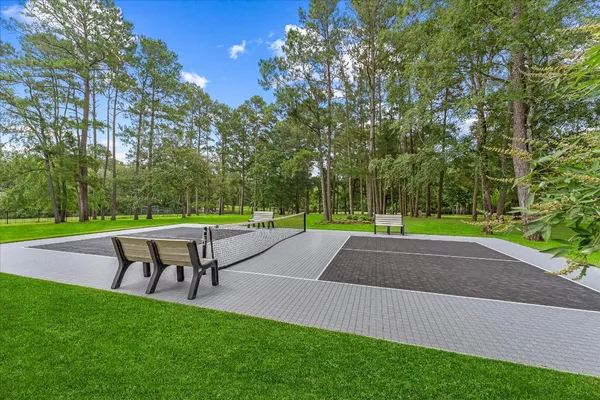 a view of yard with swimming pool and sitting area