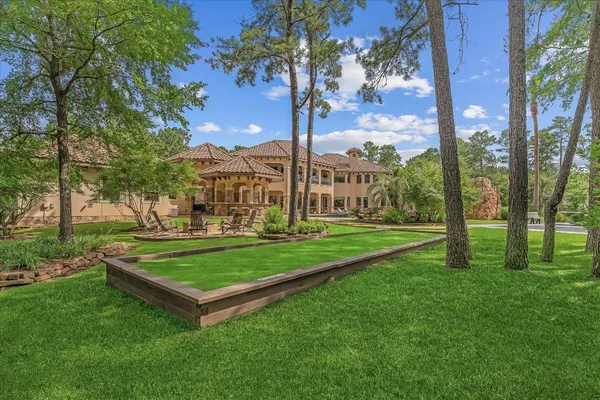 a view of a park with large trees