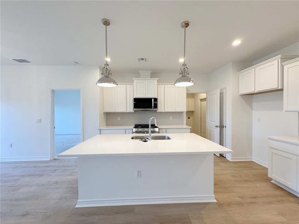 2105 Fury Portland, TX 78374 - Photo 4 of 19 a view of kitchen island with cabinets