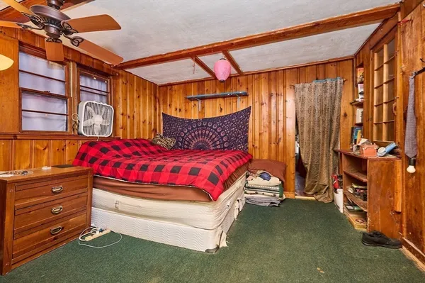 a bedroom with a bed and a cabinets