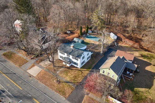 an aerial view of a house with outdoor space