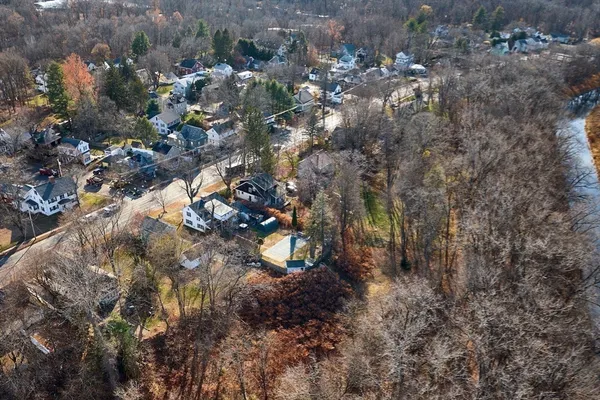 an aerial view of residential houses with city view