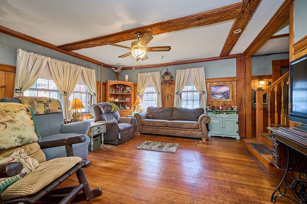 283 South Street Northampton, MA 01060 - Photo 5 of 32 a living room with furniture a fireplace and a large window