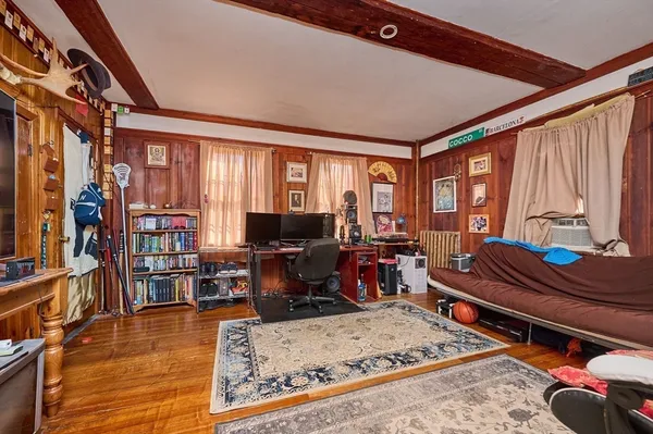 a room with furniture a rug and a large window