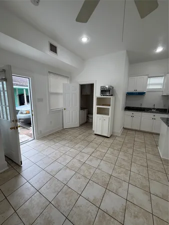 a kitchen with stainless steel appliances a refrigerator and a stove top oven
