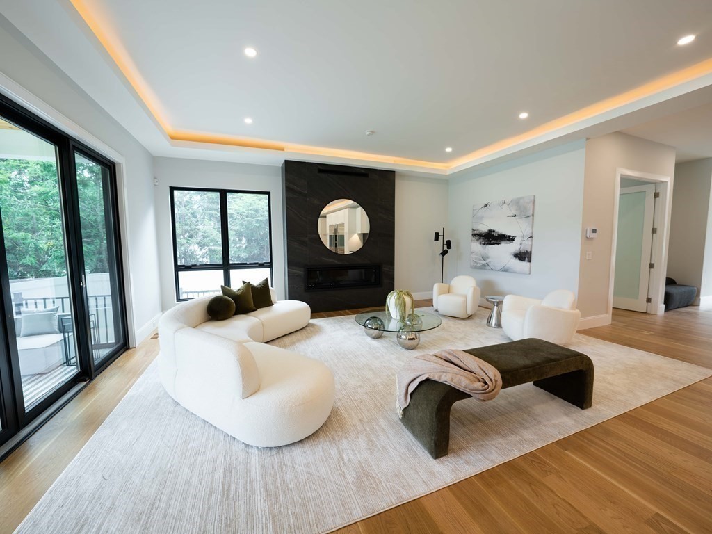 88 Levbert Road Newton, MA 02459 - Photo 11 of 41 a living room with furniture and a large window