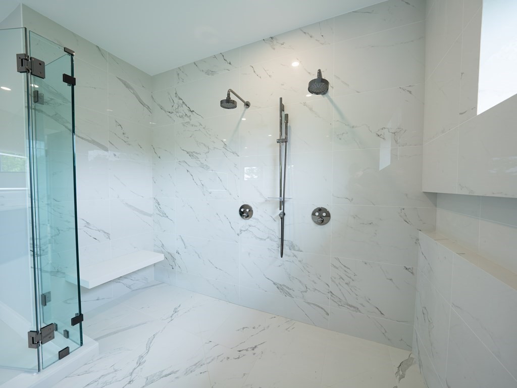 88 Levbert Road Newton, MA 02459 - Photo 22 of 41 a bathroom with a glass shower door