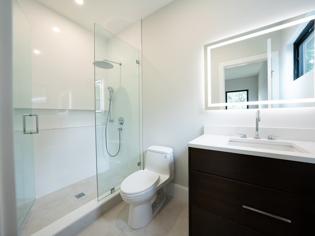 88 Levbert Road Newton, MA 02459 - Photo 29 of 41 a bathroom with a toilet sink shower and mirror