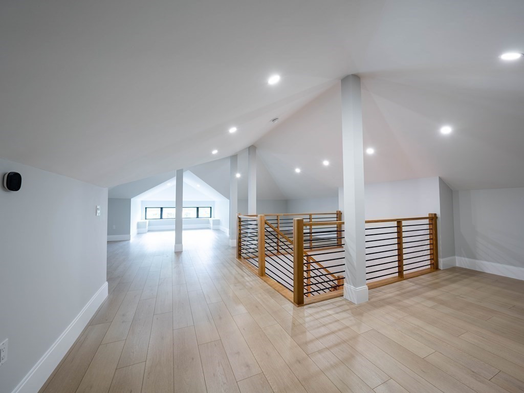 88 Levbert Road Newton, MA 02459 - Photo 30 of 41 an empty room with wooden floor and a window