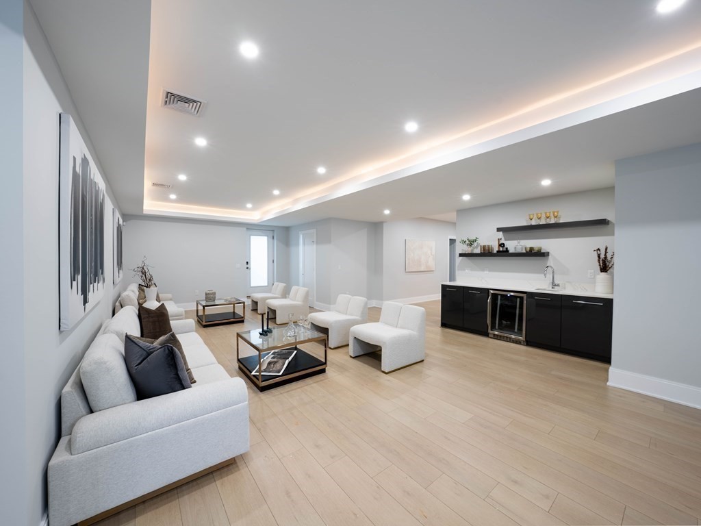 88 Levbert Road Newton, MA 02459 - Photo 32 of 41 a living room with furniture and kitchen view