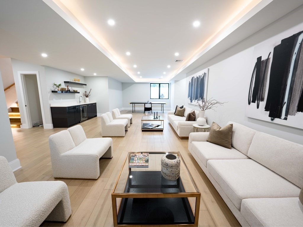 88 Levbert Road Newton, MA 02459 - Photo 33 of 41 a living room with furniture and a flat screen tv