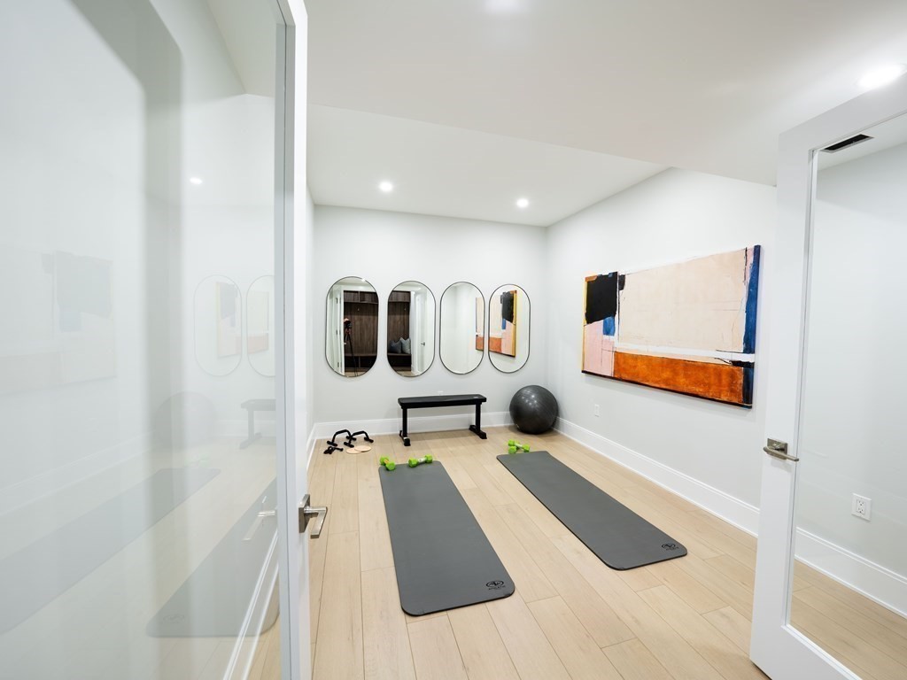 88 Levbert Road Newton, MA 02459 - Photo 37 of 41 a bathroom with a sink a mirror and tub