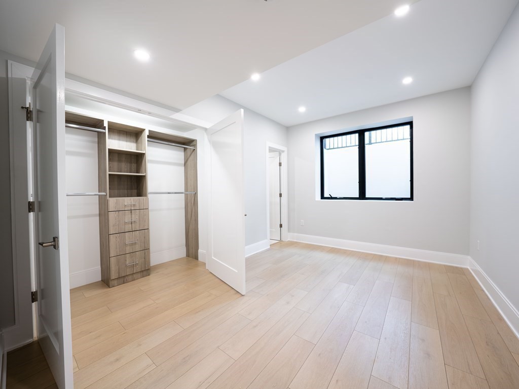 88 Levbert Road Newton, MA 02459 - Photo 39 of 41 wooden floor in an empty room with a window