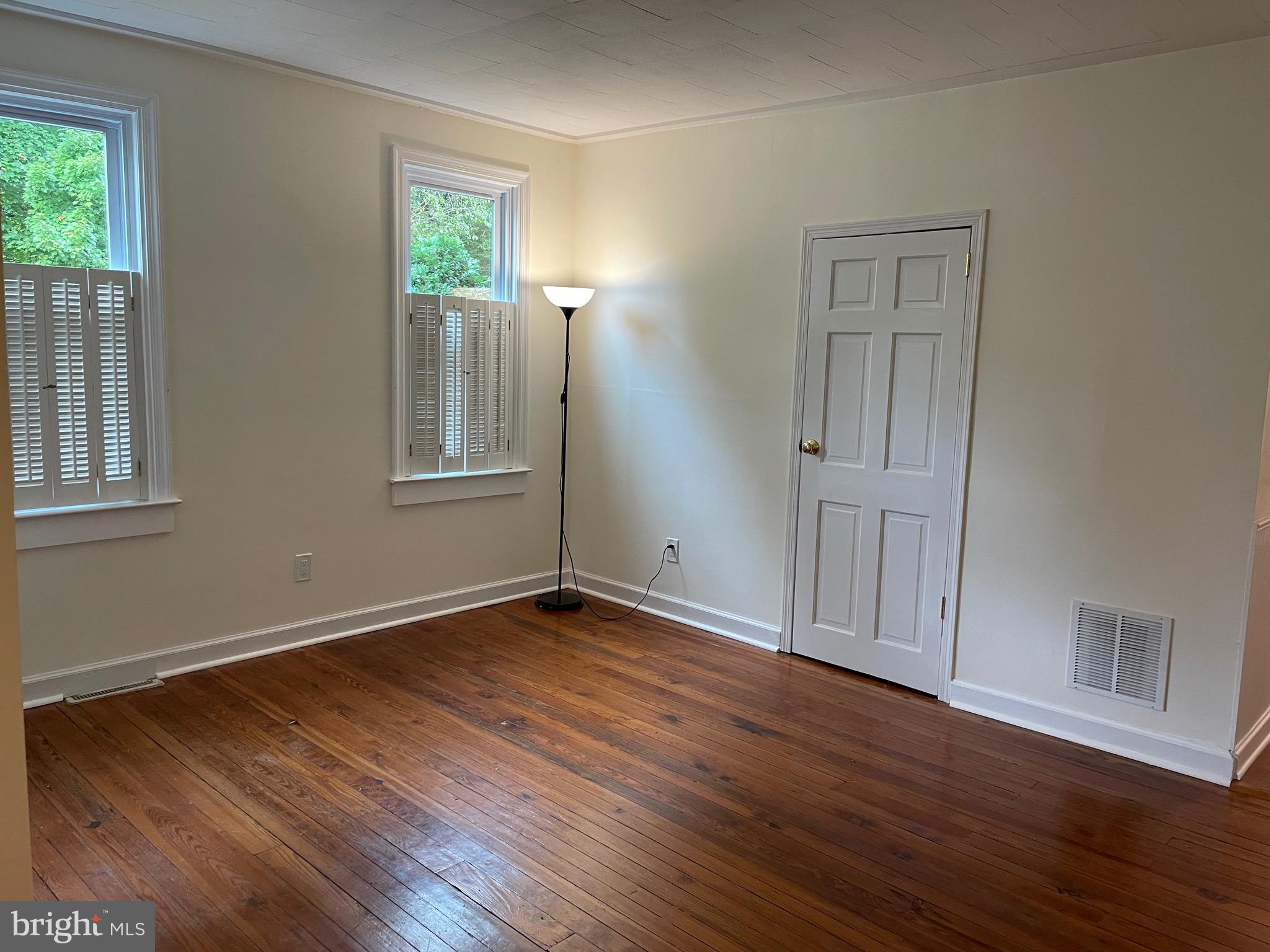 301 East Linden Street Moorestown, NJ 08057 - Photo 2 of 19 a view of an empty room with wooden floor and a window