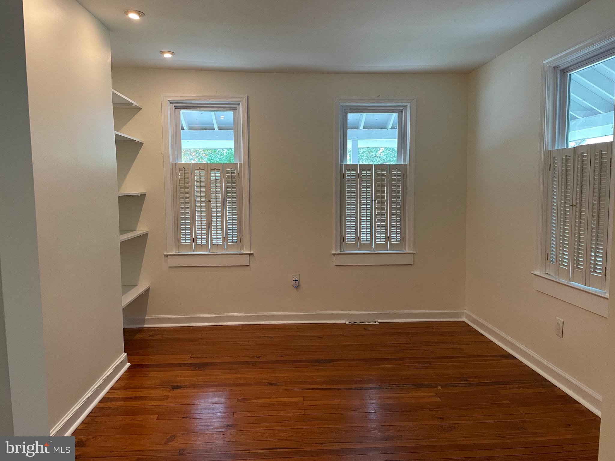 301 East Linden Street Moorestown, NJ 08057 - Photo 3 of 19 a view of an empty room with wooden floor and a window