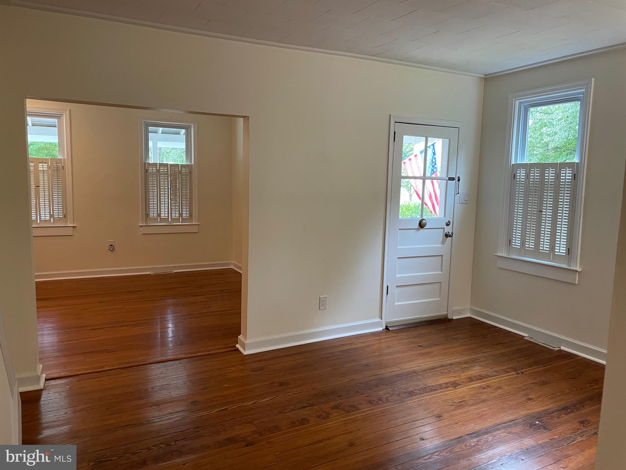 301 East Linden Street Moorestown, NJ 08057 - Photo 4 of 19 an empty room with wooden floor and windows