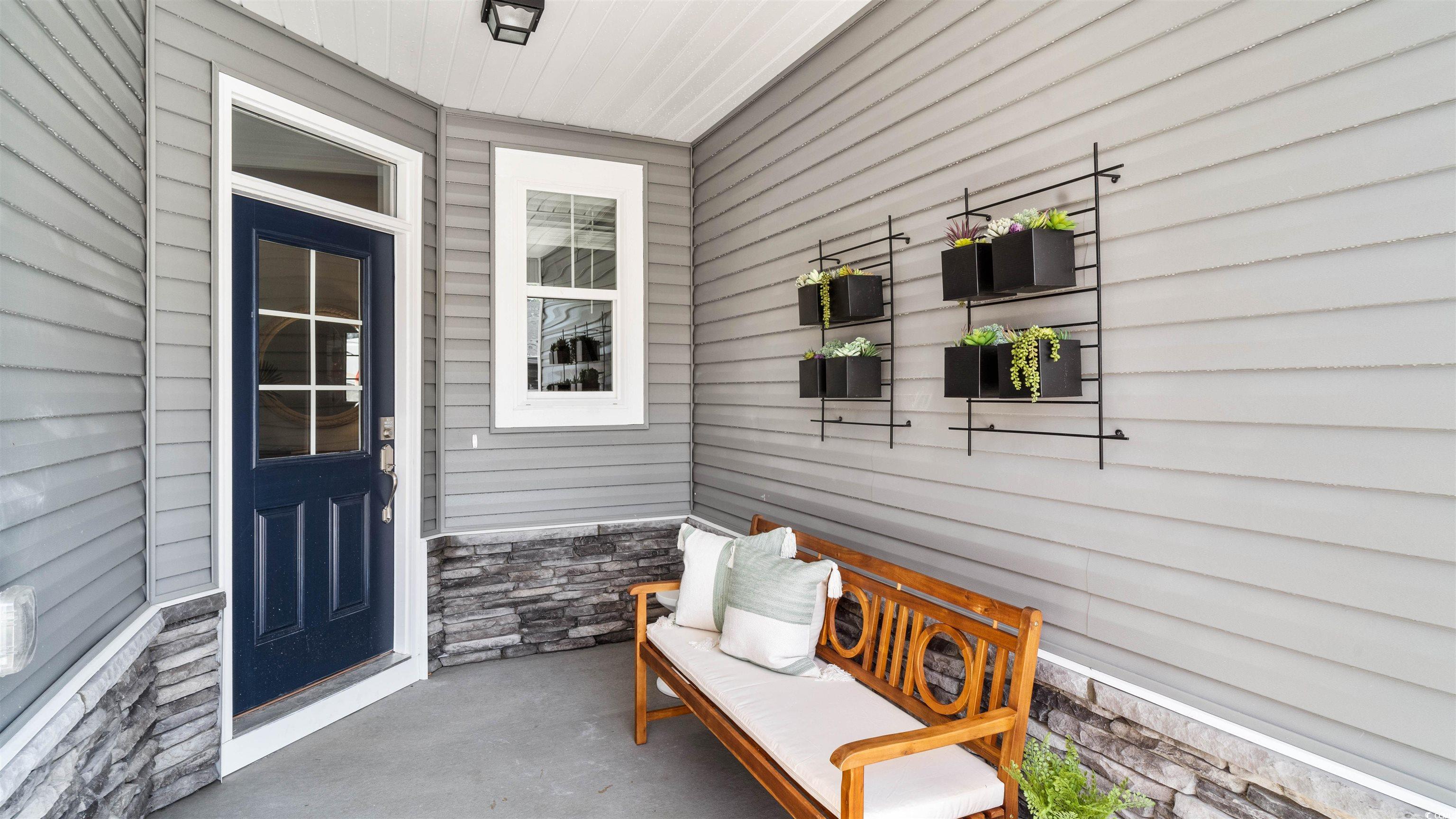 120 Furnies Place Conway, SC 29526 - Photo 2 of 22 Front porch entry. Photo is an example from a model home and displays optional features