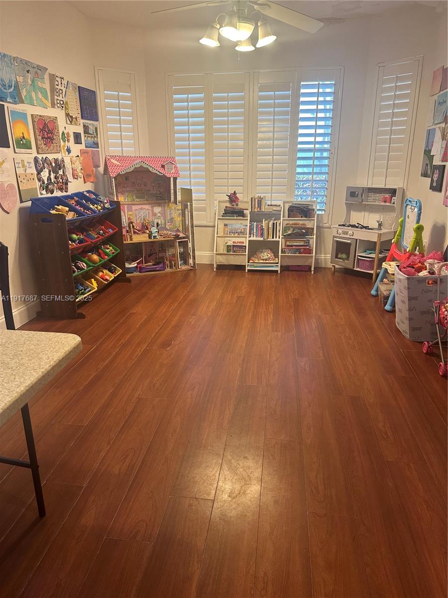 3195 North 36th Avenue Hollywood, FL 33021 - Photo 20 of 28 a living room filled with furniture window and wooden floor