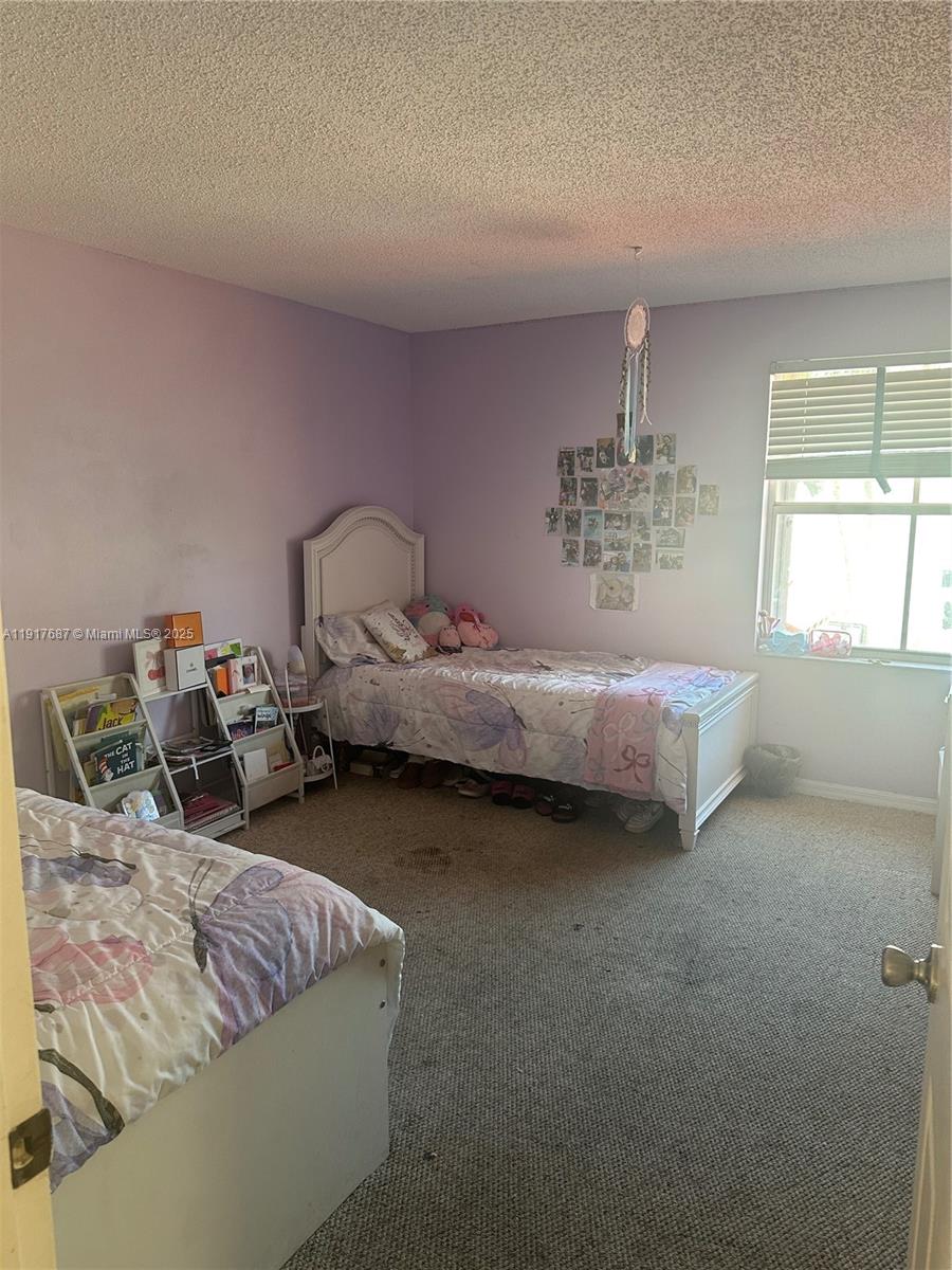 3195 North 36th Avenue Hollywood, FL 33021 - Photo 26 of 28 a bed room with two bed and a window