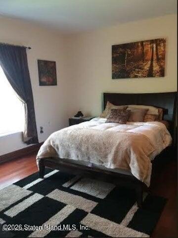 3871 Amboy Road, Unit 404 Staten Island, NY 10308 - Photo 10 of 17 a bedroom with a bed and window