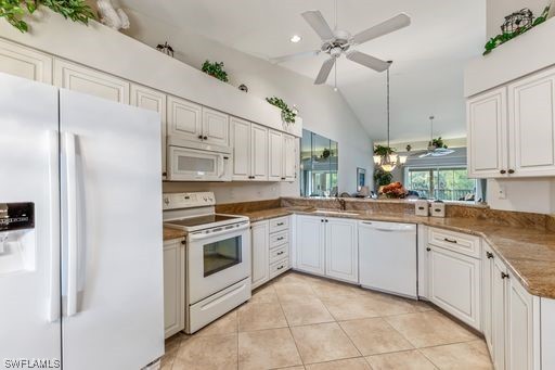 a kitchen with cabinets stainless steel appliances and a window
