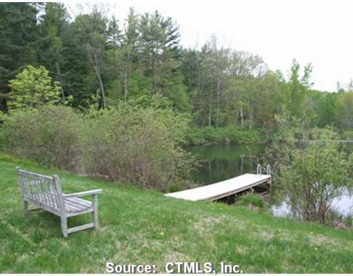 Lot 37 Drum Road Sharon, CT 06069 - Photo 1 of 1 a garden view with a bench