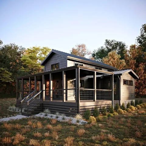 outdoor view of house with backyard space and balcony