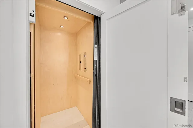 a floor to ceiling window and a fireplace