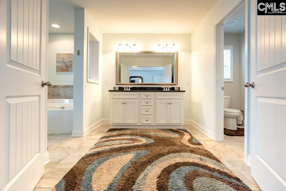 357 Cabana Way Lexington, SC 29072 - Photo 11 of 25 a bedroom with a bed and a view of living room