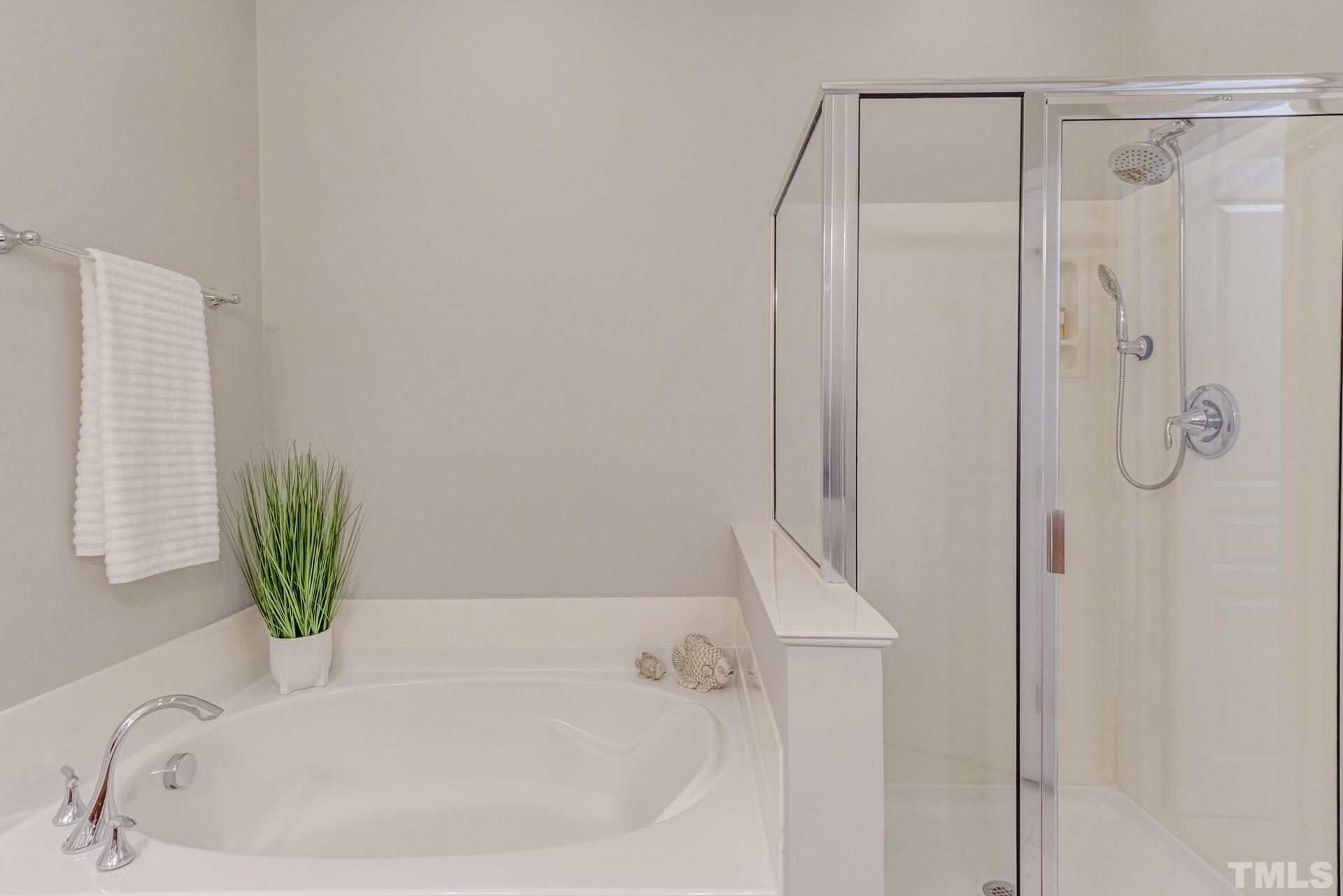 10114 Falls Meadow Court Raleigh, NC 27617 - Photo 33 of 53 a bathroom with a bathtub