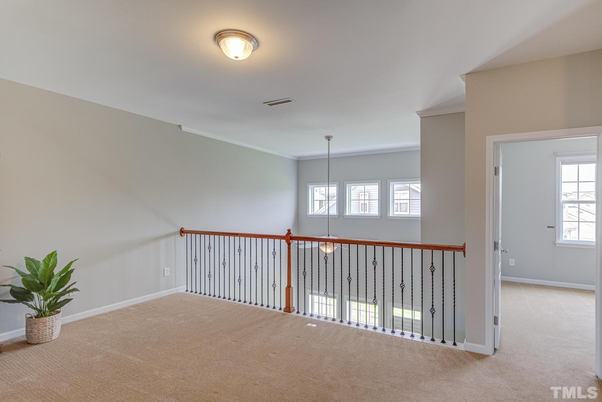 10114 Falls Meadow Court Raleigh, NC 27617 - Photo 39 of 53 a view of an empty room with a window